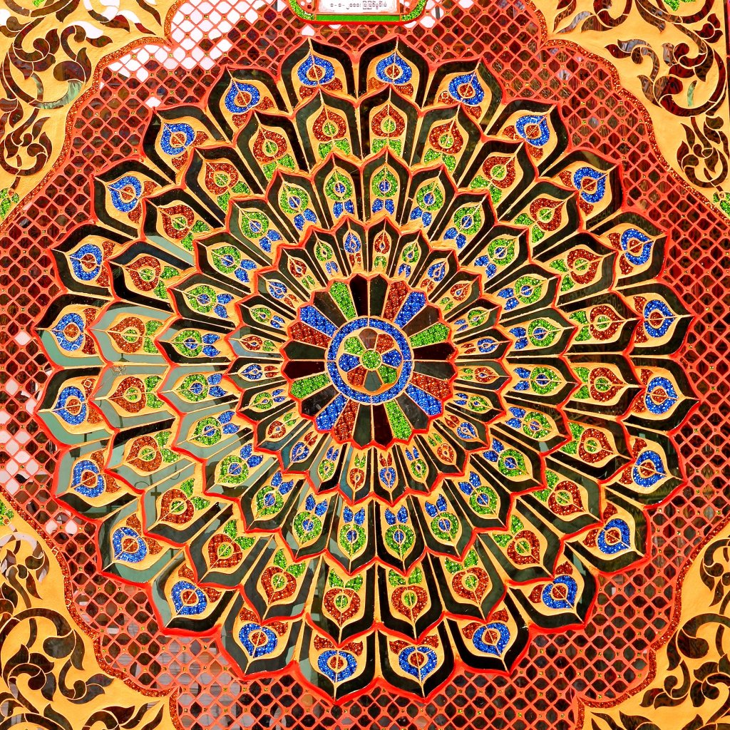 Peacock like mirrored mosaic at the Sutaungpyai Pagoda in Mandalay, Myanmar