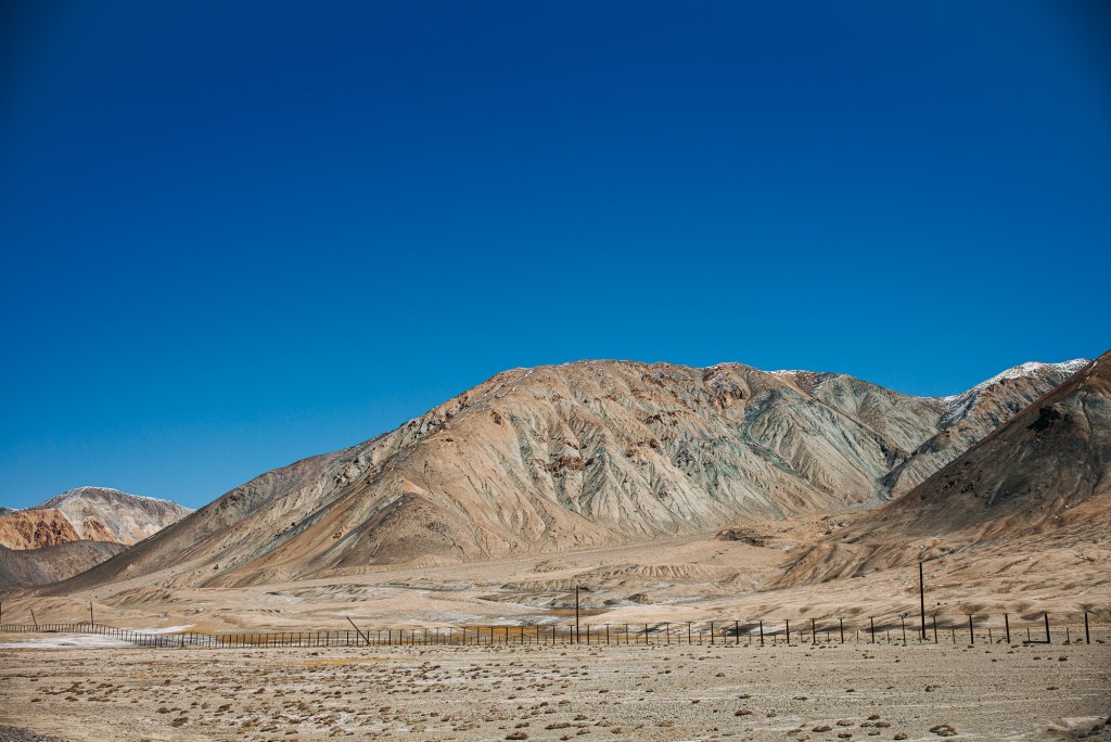 China-Tajik border with the dividing fence in view.