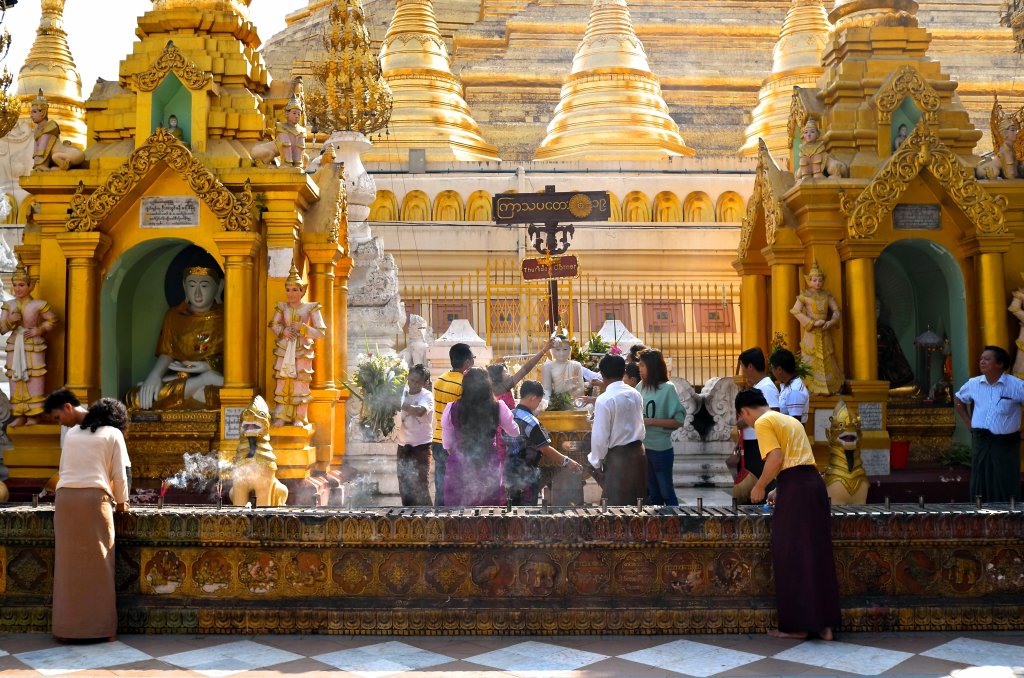 Ceremony happening in a pavilion of the Shwedagon Pagoda in Yangon, Myanmar